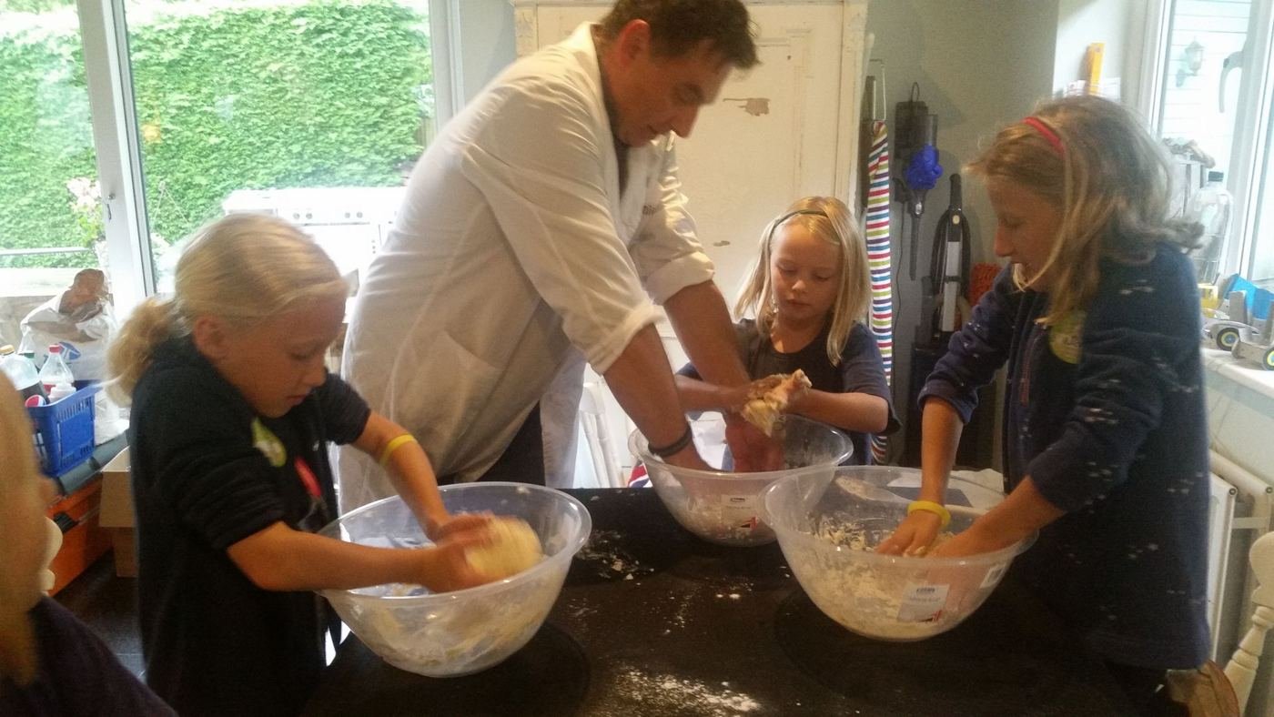 Club leader and children mixing an experiment
