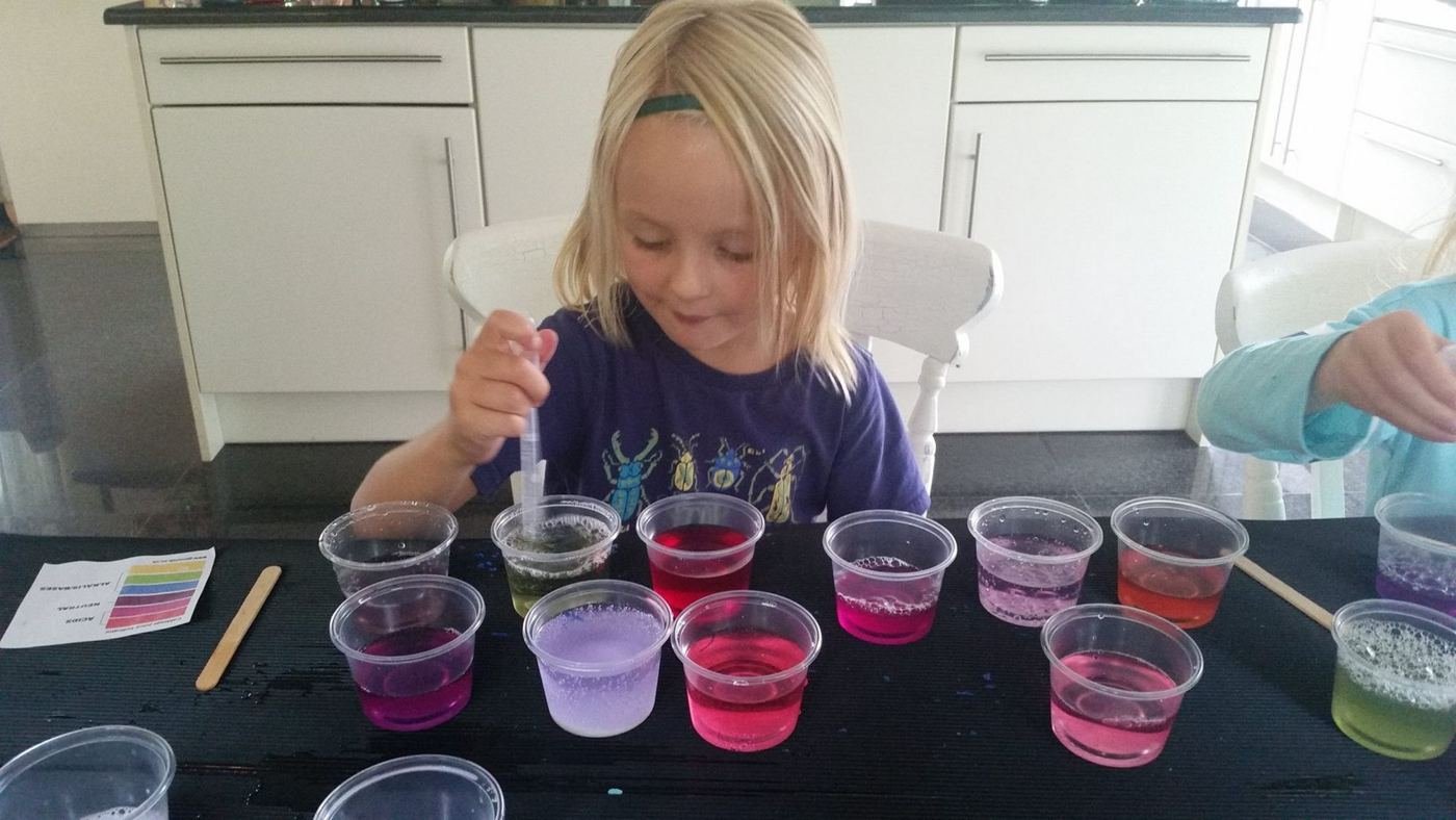 Child mixing colourful potions