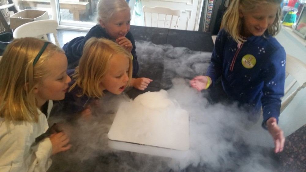 Children watching a dry-ice experiment