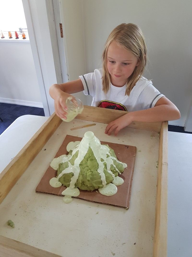 Child making a volcano experiment